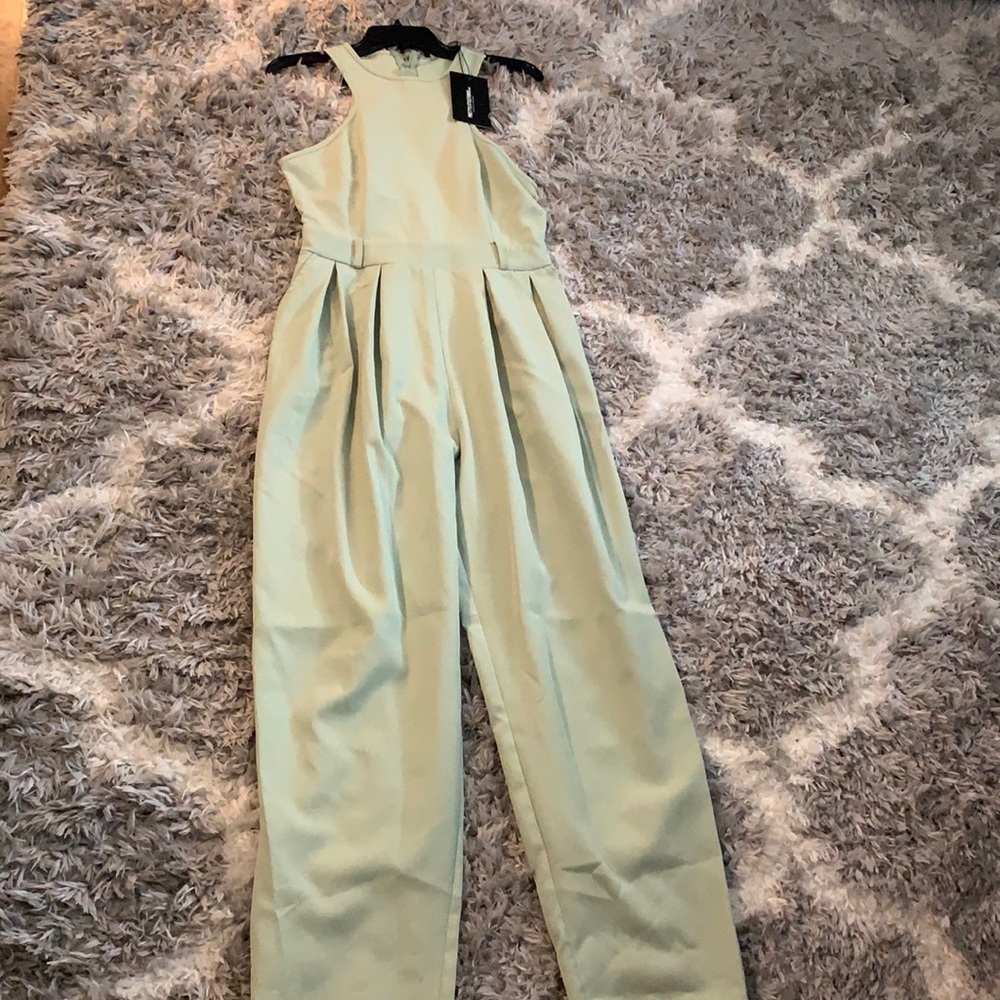 Sage green racer back jumpsuit with pockets!